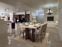 Open-concept dining area features neutral decor and seamlessly connects living spaces at 5554 Chicory Falls Ct, Las Vegas, NV 89148