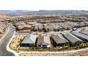 Gorgeous aerial view showcasing the community with well-maintained streets and beautiful landscaping at 59 Desert Ivy Ln, Henderson, NV 89011