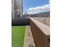 Spacious backyard featuring low-maintenance landscaping and well-defined property lines at 600 N Carriage Hill Dr # 1019, Las Vegas, NV 89138