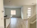 Bright and airy living room with hardwood floors and natural light at 600 N Carriage Hill Dr # 1019, Las Vegas, NV 89138