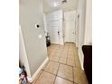 Hallway offering neutral wall colors, tiled floors, and doors leading to rooms at 6819 Mahogany Meadows Ave, Las Vegas, NV 89122