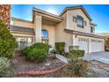 Attractive two-story home with a three-car garage and landscaped front yard, showcasing curb appeal at 6971 Cedar Basin Ave, Las Vegas, NV 89142