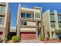 Modern three-story home boasting a roof deck, balcony, two-car garage, and desert landscaping at 7953 Mountain Lilac St, Las Vegas, NV 89113