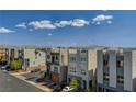Street view of modern three-story homes with rooftop decks in a well-planned community at 7953 Mountain Lilac St, Las Vegas, NV 89113