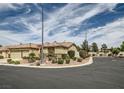 A charming single story home is shown with desert landscaping and a circular driveway at 8698 Waterford Bend St, Las Vegas, NV 89123