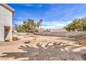 Large, unfinished backyard space with potential for landscaping and outdoor living features at 1009 Nawkee Dr, North Las Vegas, NV 89031
