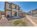 Spacious backyard with potential for customization, featuring a concrete patio and gravel landscaping at 1129 Paradise Vista Dr, Henderson, NV 89002