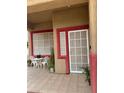 Covered patio with outdoor seating area and view of the yard at 1286 N Sloan Ln, Las Vegas, NV 89110