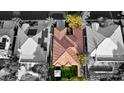 Aerial view of a home with a red tile roof, surrounded by mature landscaping at 129 Chateau Whistler Ct, Las Vegas, NV 89148