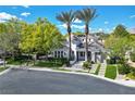 Charming home featuring mature trees, professional landscaping and driveway leading to the garage at 1309 Reisling Ct, Las Vegas, NV 89144