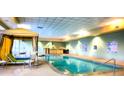 Serene indoor pool area with ample seating and natural light at 211 E Flamingo Rd # 1012, Las Vegas, NV 89169