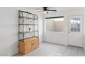 Well-lit room with ceiling fan and display shelving at 2219 Rugged Mesa Dr, Laughlin, NV 89029