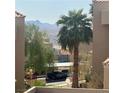 Scenic view from this home overlooking palm trees, mountains, and the neighborhood at 2232 Aspen Mirror Dr # 203, Laughlin, NV 89029