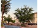 Black Horse community entrance with lush trees and well-kept landscape at 3400 Cabana Dr # 1061, Las Vegas, NV 89122