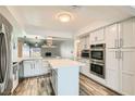 Modern kitchen with stainless steel appliances, an island, and updated countertops at 4347 S Mojave Rd, Las Vegas, NV 89121