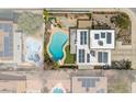 Aerial view of the backyard featuring a refreshing pool and patio area with solar panels at 4394 El Campana Way, Las Vegas, NV 89121
