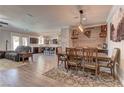 Open-concept living space with dining area, island seating, and stylish furniture at 5629 Portage Lake Ct, Las Vegas, NV 89130