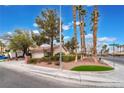 Single-story home featuring desert landscaping, tile roof, and mature trees at 6654 Coronado Crest Ave, Las Vegas, NV 89139