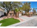 Beautiful single-story home with mature trees and landscaped front yard at 6654 Coronado Crest Ave, Las Vegas, NV 89139