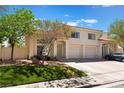 Beautiful home with attached two car garage, mature tree and well maintained lawn at 7945 Delbonita Ave, Las Vegas, NV 89147