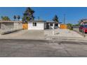 Charming single-story home featuring a well-maintained lawn and front yard with decorative rock at 824 N 20Th St, Las Vegas, NV 89101