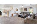 Inviting living room with plush carpeting, neutral walls, and ample natural light at 9785 Iron Mine St, Las Vegas, NV 89183