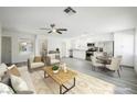 Bright, open concept living and dining area with neutral decor and modern finishes and lots of light at 10 Yew Ave, Las Vegas, NV 89110