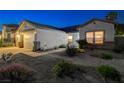 Charming single-story home featuring a two-car garage, desert landscaping, and inviting curb appeal at 1078 Sandstone Canyon St, Henderson, NV 89012