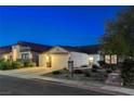 Charming single-story home featuring a three-car garage, manicured landscaping, and inviting curb appeal at 1078 Sandstone Canyon St, Henderson, NV 89012