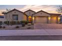 Charming single-story home with a well-manicured front yard and a paver driveway leading to a three-car garage at 11274 Felice Cohn Ct, Las Vegas, NV 89179
