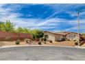 Full view of a charming single-story home featuring desert landscaping and a two-car garage at 11342 Early Sun Ct, Las Vegas, NV 89135