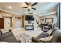Bright living room featuring tile floors, a ceiling fan, and comfortable gray couches at 220 E Flamingo Rd # 402, Las Vegas, NV 89169