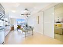 Open-concept dining area with modern lighting, a glass table set and city views at 3726 Las Vegas Blvd # 2605, Las Vegas, NV 89158