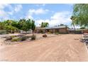 Front exterior view of a single story home featuring desert landscaping at 5312 Manuel Dr, Las Vegas, NV 89149