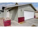 Charming single-story home features an attached two-car garage and a well-maintained front yard at 5620 Pinecone Pl, Las Vegas, NV 89108