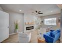 Inviting living room showcasing a modern fireplace, stylish decor, and ample natural light at 700 Cactus Ln, Las Vegas, NV 89107