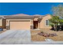 Charming single-story home featuring a two-car garage and xeriscaping for low maintenance and water conservation at 7556 Wingspread St, North Las Vegas, NV 89084