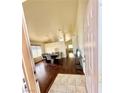 The entryway welcomes you with wood floors, neutral paint and a clear view of the dining area and living spaces at 7821 Desert Bell Ave, Las Vegas, NV 89128