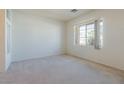 Cozy bedroom with large window, plush carpet and neutral paint at 8249 Jo Marcy Dr, Las Vegas, NV 89131