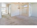 Bright living room with neutral carpeting, high ceilings, and ample natural light at 8249 Jo Marcy Dr, Las Vegas, NV 89131