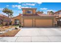 Charming two-story home with a well-manicured front yard and a two car garage at 8277 Mount Nido Dr, Las Vegas, NV 89147