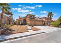 Charming two-story home with a well-manicured front yard and a two car garage at 8277 Mount Nido Dr, Las Vegas, NV 89147