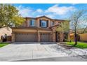 Beautiful two-story home offers a three-car garage, well-maintained landscaping, and an appealing stone and stucco design at 8537 Eureka Heights Ct, Las Vegas, NV 89178