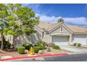 Charming single-story home features a tile roof, two-car garage, and well-maintained landscaping at 9664 Emeraude Ave, Las Vegas, NV 89147