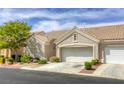 Charming single-story home features a tile roof, two-car garage, and well-maintained landscaping at 9664 Emeraude Ave, Las Vegas, NV 89147