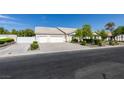 Charming single-story home featuring a three-car garage, well-maintained landscaping, and a lengthy driveway at 1341 Marina Del Rey Ct, Las Vegas, NV 89117