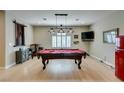 Game room with pool table, lighting, bar stools and a retro refrigerator, perfect for entertaining at 1341 Marina Del Rey Ct, Las Vegas, NV 89117