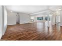 Bright and open living room featuring hardwood floors and a modern fireplace at 2205 Sombrero Dr, Las Vegas, NV 89169