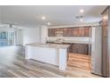 Well-lit kitchen featuring an island with granite countertops and stainless steel appliances at 2843 Kona Blue Ln # 4, Las Vegas, NV 89183