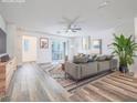 Inviting staged living area showcasing modern decor and a sliding door to a balcony at 2843 Kona Blue Ln # 4, Las Vegas, NV 89183